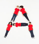 Image of Letter A made up of children